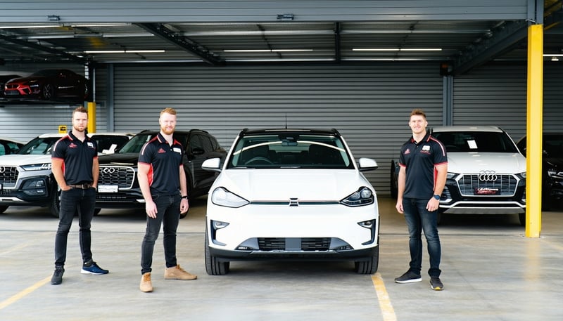 Coastline Auto Brokers team assisting a client with car selection